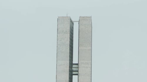 Tower of the Brazilian Congress Building in Brasilia in a Rainy Cloudy Day - Close View - Tilt Shot