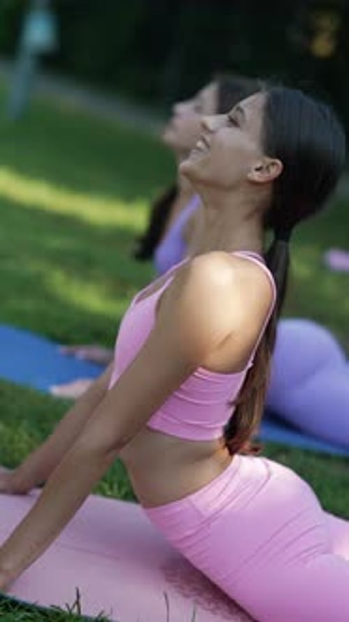Participating in Sports a Mother and Her Athletic Daughter are Enjoying the Summer Park