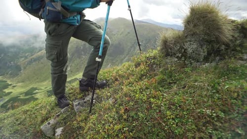 On a Hike Male Legs Closeup Climbing to the Top of a Mountain