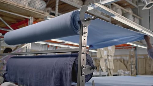 Details of a Workshop of Textile Fabric Media Rolls of Blue Fabric at the Textile Factory