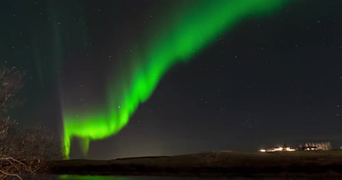 time lapse of northern lights in iceland with reflection in water