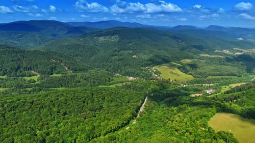 Lush green mountain landscape. Lush green mountains stretch across the horizon under