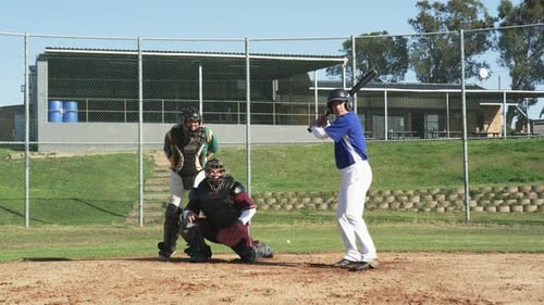 Baseball Batter Hits Ball on Field During Game