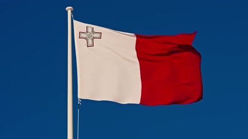 Malta Flag Waving Proudly Against a Clear Blue Sky