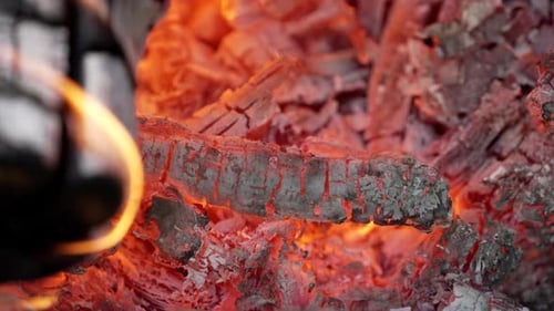 Glowing Embers In Hot Red Color - Hot Embers Of Burning Wood - close up shot