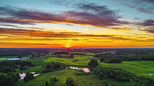 Majestic Golden Sunrise Over Lush Green Countryside