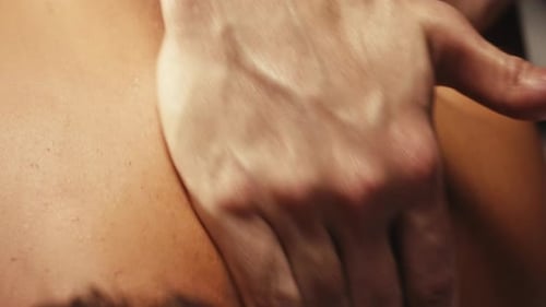 Man Receives Relaxing Back Massage Close Up