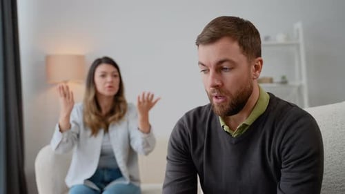 Couple Arguing in Living Room