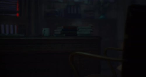 A Darkened Study with a Desk Books and a Coffee Cup at Night