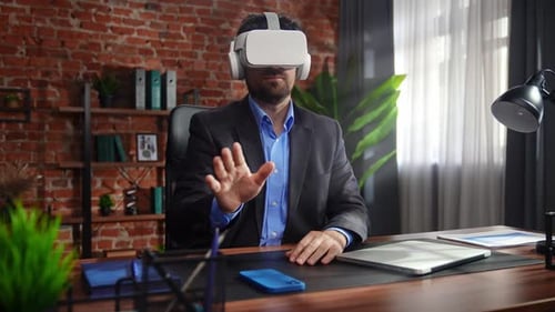 Business Professional Using Virtual Reality Headset in Office