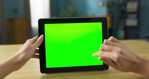 Hands Tapping and Swiping Tablet with Green Screen