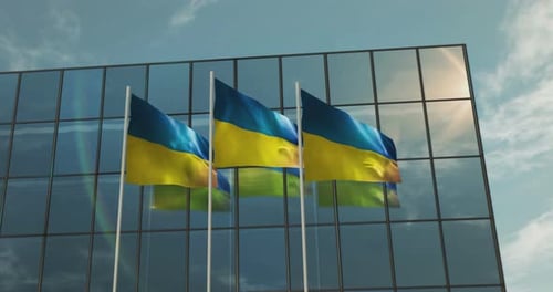National Ukrainian Flags Waving in Front of Corporate Glass Building