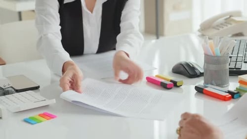 Client Getting Financial Consultation by Bank Agent in Office