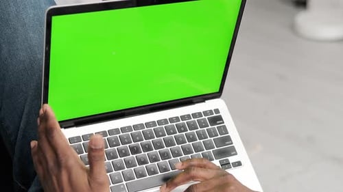 Black Man Using Laptop Notebook Viewing Green Screen Press Keyboard Browsing Chroma Key African