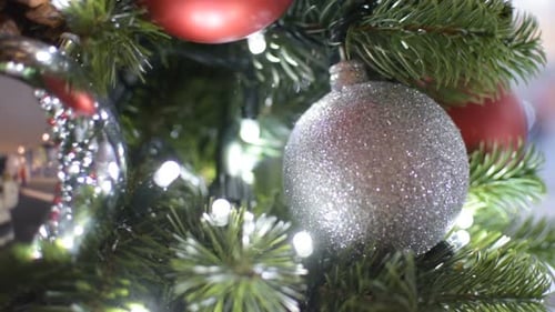 Christmas Tree Decorated with Silver and Red Ornaments