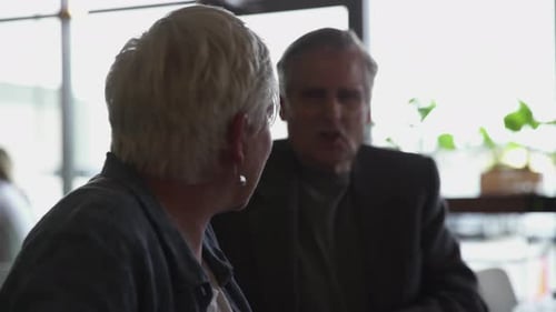 Senior Couple Talking in Cafe 6064 Years