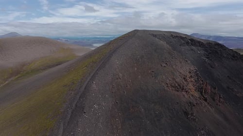 Aerial View of Iceland's Volcanic Plain with River and Mountains