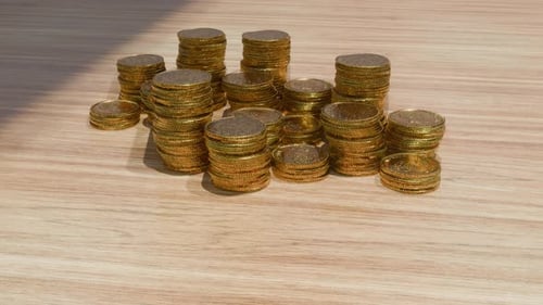 Stacks Of Gold Coins On A Table 4K