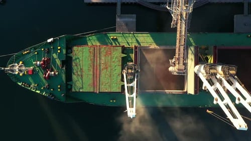 Aerial View Fom Above Wheat Loading to Bulker Ship Cargo Hold at Sea Grain Elevator in Sea Port