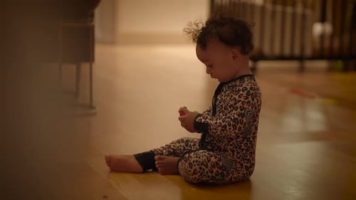 Baby Playing with Toy Indoors