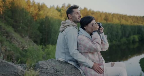 Slow Motion of Happy Girl and Guy Taking Photo with Modern Camera Enjoying Spectacular View of