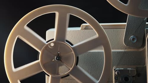 Vintage Film Projector Spinning its Reels in Close-Up