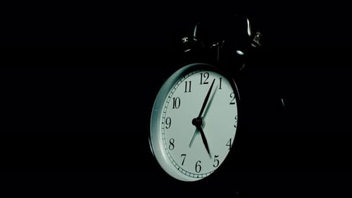 Close Up of Alarm Clock Face in Dark
