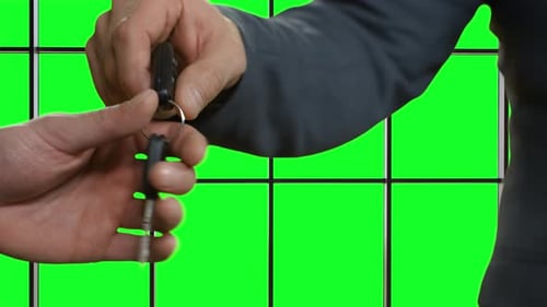 Male Hands Pass Car Key