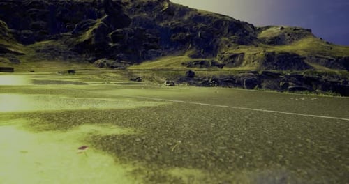 Bright Landscape with Winding Road and Hills Under Clear Sky
