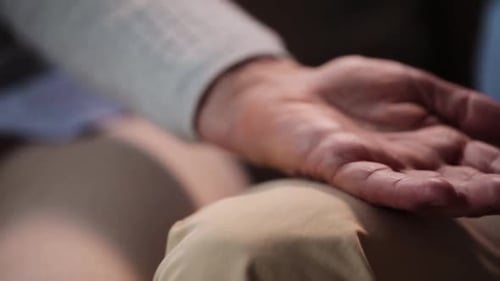 Loving Couple Holding Hands in Close Up