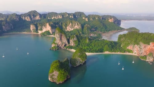 Enjoy a Stunning Aerial View of Krabi Thailand at Sunset with a Longtail Boat in Paradise