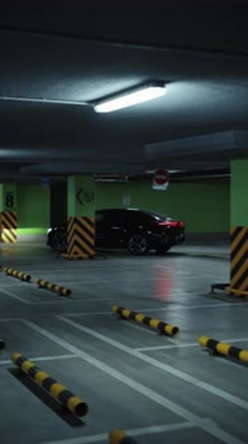 Black Electric Sedan Parked in Underground Garage