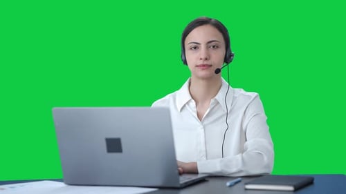 Indian call center girl looking at the camera Green screen