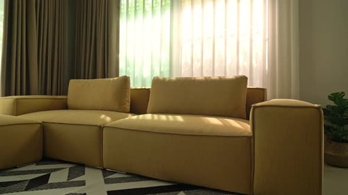 Sunlit Living Room with Mustard Sectional Couch