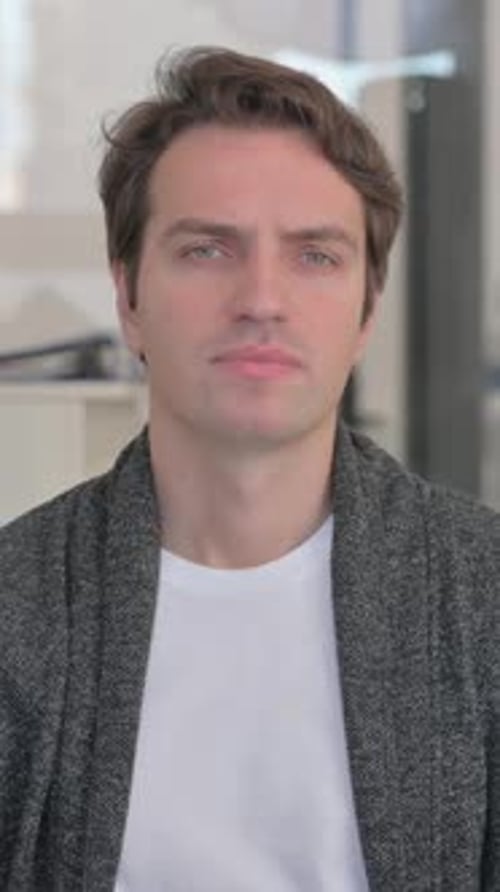 Man with Headache Rubbing Temples in Vertical Video