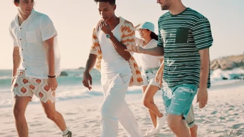 Group, friends and walking on beach for travel with bonding, conversation and wind for vacation