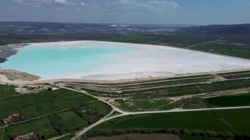 Toxic reservoir contaminated by bright blue sludge from synthetic soda ash. Padina village, Bulgaria