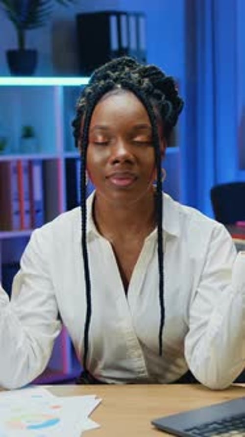 Beautiful Calm Goodnatured African Woman Office Mananger in White Blouse Making Break in Her