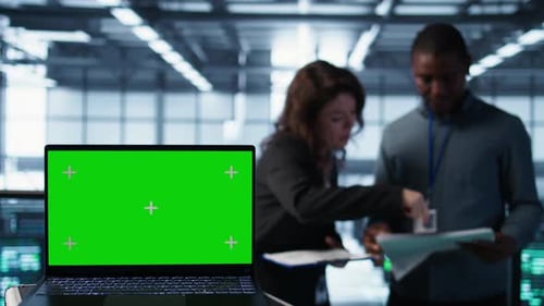 Chroma Key Notebook Used By Coworkers Adjusting Server Room Configurations