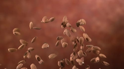 Almonds Falling in Slow Motion Against Brown Background