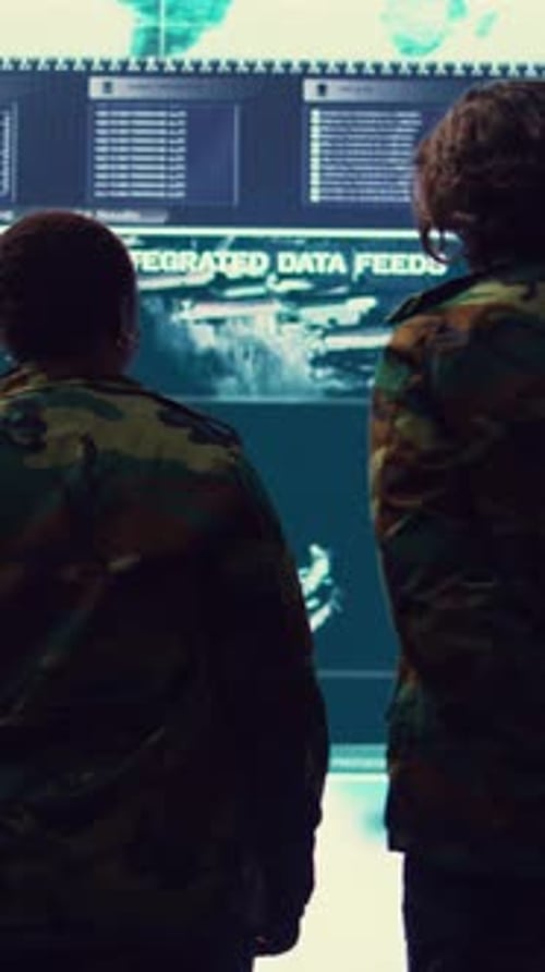 Vertical Video Military Surveillance Officers Talk Next to Big Screen in General Headquarters
