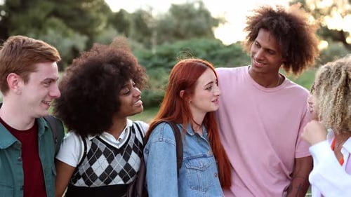 Happy Young Adults Chatting in an Urban Park