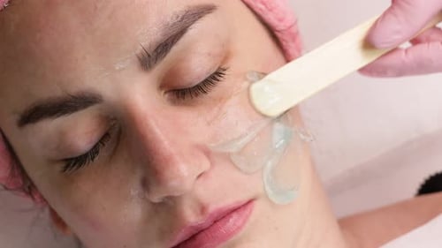 Woman Receiving Facial Treatment with Gel Application