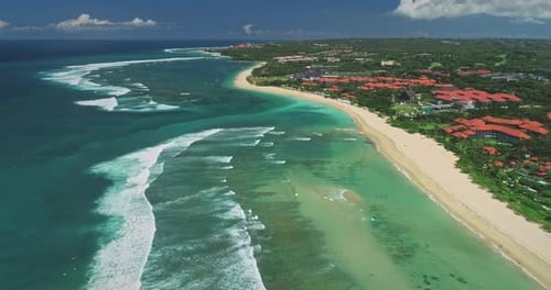Nusa Dua Beach and Luxury Hotels Meeting Turquoise Indian Ocean in Bali Aerial View