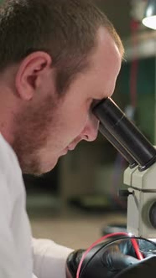 Scientist Using Microscope in Modern Laboratory
