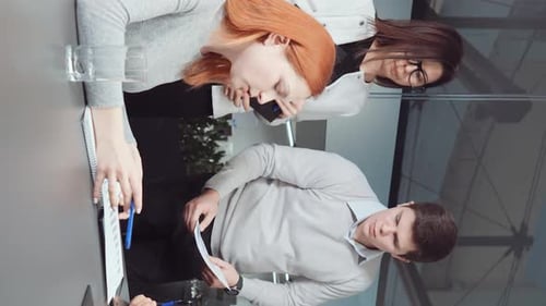 Team Working at Conference Table in Vertical Video
