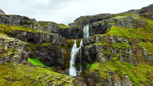 Wispy Waterfalls Flowing Over Cliff Mountain River Falling Over Cliff Creating Many Waterfalls with