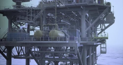 Offshore Oil Rig with Complex Structure and Operational Equipment at Dawn