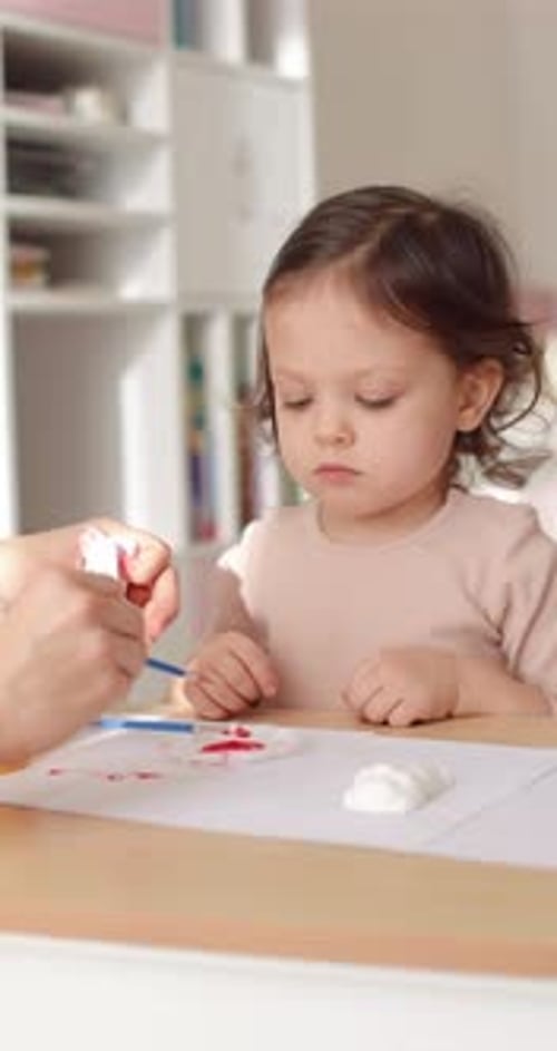 Adorable Child Painting with Brush at Home