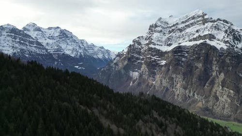 Breathtaking Aerial shot of Mountain Peaks in Fronalpstock Glarus Switzerland